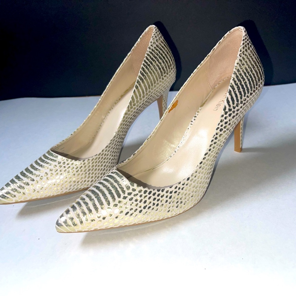 Calvin Klein Ivory Pumps with Gold detailing.